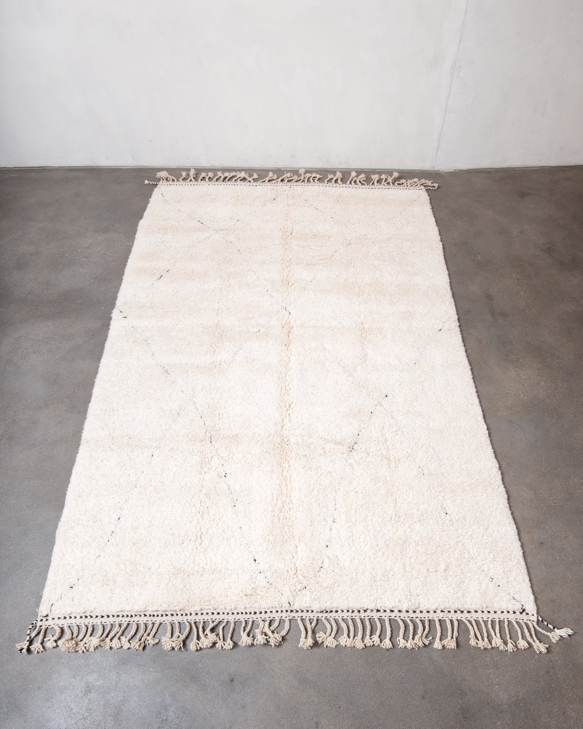 Modern, designer, handcrafted Berber rug from Morocco. Beniourain carpet with minimalist design, natural wool pile and a fluffy texture.